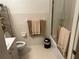 Clean bathroom with white tile and shower at 5990 Terrace Park N Dr # 109, St Petersburg, FL 33709