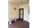 Inviting entryway with a brick-style tile floor, bench, and updated front door at 5990 Terrace Park N Dr # 109, St Petersburg, FL 33709