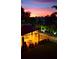 Community outdoor area with seating and dusk lighting at 5990 Terrace Park N Dr # 109, St Petersburg, FL 33709