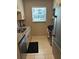 Modern kitchen featuring granite countertops, stainless steel appliances, and ample cabinet space at 5990 Terrace Park N Dr # 109, St Petersburg, FL 33709