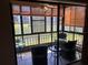 Relaxing screened-in lanai with ceiling fan and water view at 5990 Terrace Park N Dr # 109, St Petersburg, FL 33709