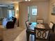 Combined living room and dining area with plenty of space for entertaining at 5990 Terrace Park N Dr # 109, St Petersburg, FL 33709