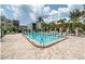 Community pool with plenty of lounge chairs at 5990 Terrace Park N Dr # 109, St Petersburg, FL 33709