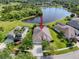 Aerial view of the home with a pool, overlooking the lake, nestled within a beautiful community at 6208 Bridgevista Dr, Lithia, FL 33547