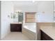 Bright bathroom with soaking tub, and vanity with mirrors at 6208 Bridgevista Dr, Lithia, FL 33547