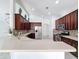 Well-lit kitchen featuring stainless steel appliances, dark wood cabinets, and a breakfast bar at 6208 Bridgevista Dr, Lithia, FL 33547