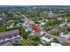 Aerial view of a charming home nestled in a lush, green neighborhood, showcasing its prime location and peaceful surroundings at 6592 Mango S Ave, St Petersburg, FL 33707