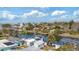 Aerial view of neighborhood homes and docks on the canal leading to the ocean on a sunny day at 6801 Clark St, Hudson, FL 34667
