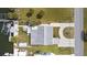 Overhead view shows a home with a dock, boat lift, nicely landscaped yard, and circular driveway at 6801 Clark St, Hudson, FL 34667
