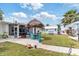 Picturesque backyard with a tiki hut, boat dock, lush lawn, and inviting outdoor space for entertainment at 6801 Clark St, Hudson, FL 34667