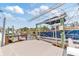 Modern boat lift system on the water with a boat, providing convenient access for boating enthusiasts at 6801 Clark St, Hudson, FL 34667