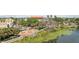 Beautiful waterfront view of the city park and lily pads with nearby charming buildings at 701 Mirror Lake N Dr # 100, St Petersburg, FL 33701