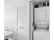Convenient in-unit stackable washer and dryer near the dining area at 701 Mirror Lake N Dr # 100, St Petersburg, FL 33701
