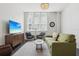 Inviting living room featuring comfortable seating, bright natural light, and stylish decor at 701 Mirror Lake N Dr # 100, St Petersburg, FL 33701