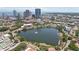 Stunning aerial view of a cityscape with a tranquil lake featuring a fountain in the foreground at 701 Mirror Lake N Dr # 119, St Petersburg, FL 33701