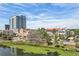 Scenic aerial view of a town's lakefront area near commercial and residential buildings at 701 Mirror Lake N Dr # 119, St Petersburg, FL 33701
