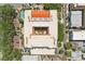 Unique aerial view showcases the building's architectural design, featuring a red tile roof and central courtyard at 701 Mirror Lake N Dr # 119, St Petersburg, FL 33701