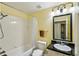 Bathroom features a shower, toilet, and sink at 701 Mirror Lake N Dr # 119, St Petersburg, FL 33701