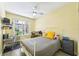 Bedroom equipped with office and shelving, and queen bed at 701 Mirror Lake N Dr # 119, St Petersburg, FL 33701