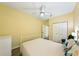 Bedroom featuring a ceiling fan, closet, and bed at 701 Mirror Lake N Dr # 119, St Petersburg, FL 33701