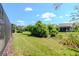 A well-maintained lawn and patio creates an inviting backyard space at 7441 Trovita Rd, Land O Lakes, FL 34637