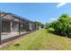 A well-maintained lawn and patio creates an inviting backyard space at 7441 Trovita Rd, Land O Lakes, FL 34637