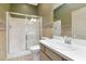 Bathroom featuring a glass enclosed shower, tile backsplash and a vanity with a sink at 7441 Trovita Rd, Land O Lakes, FL 34637