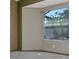 Bedroom featuring neutral paint and a large window with natural light at 7441 Trovita Rd, Land O Lakes, FL 34637