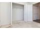 Empty bedroom closet with bi-fold doors and wire shelving at 7441 Trovita Rd, Land O Lakes, FL 34637