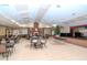 Versatile event space with ample seating, stage, and festive holiday decorations at 7441 Trovita Rd, Land O Lakes, FL 34637