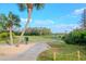 Picturesque golf course with a winding path, green landscape, and clear blue sky at 7441 Trovita Rd, Land O Lakes, FL 34637