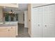 Open kitchen with a view to the dining area, featuring light wood cabinets and tile backsplash at 7441 Trovita Rd, Land O Lakes, FL 34637
