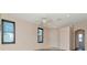 Living room with ceiling fan and wood laminate flooring at 7441 Trovita Rd, Land O Lakes, FL 34637