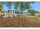 The backyard features a swing set, fire pit, patio, and sunroom at 783 41St Ne Ave, St Petersburg, FL 33703