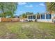 The yard features a swing set, fire pit, patio and a sunroom at 783 41St Ne Ave, St Petersburg, FL 33703
