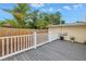 A wood deck overlooks a spacious, fenced backyard with lush landscaping at 783 41St Ne Ave, St Petersburg, FL 33703