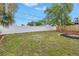 The property features a white vinyl fence, a swing set, and a fire pit at 783 41St Ne Ave, St Petersburg, FL 33703