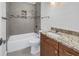 Bathroom featuring a granite vanity, tiled shower, and updated fixtures at 783 41St Ne Ave, St Petersburg, FL 33703