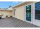 Exterior shot shows a deck space and glass patio doors to the sunroom at 783 41St Ne Ave, St Petersburg, FL 33703