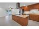 Updated kitchen featuring wooden cabinets, stainless steel appliances, and granite countertops at 783 41St Ne Ave, St Petersburg, FL 33703