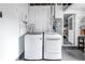 Well-lit laundry room with white washer and dryer set in a functional space at 783 41St Ne Ave, St Petersburg, FL 33703