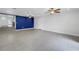 Spacious living room featuring recessed lights, ceiling fans, and bold blue accent wall at 783 41St Ne Ave, St Petersburg, FL 33703