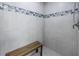 Upgraded shower with tiled bench, neutral surround, and modern fixtures at 783 41St Ne Ave, St Petersburg, FL 33703