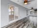 View of sunroom featuring wood-look floors and multiple windows leading to backyard at 783 41St Ne Ave, St Petersburg, FL 33703