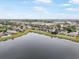 Aerial view of the community showing lake and several houses at 810 Fern Leaf Dr, Ruskin, FL 33570