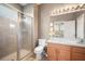 Bathroom featuring tile floors, a glass-enclosed shower, wood cabinet sink, and neutral walls at 810 Fern Leaf Dr, Ruskin, FL 33570