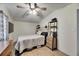 Comfortable bedroom showcasing wood floors and shelving units for organization at 8805 Cobb Rd, Riverview, FL 33578