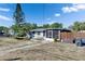 Cozy home featuring a hammock, inviting entrance and manicured landscaping at 8805 Cobb Rd, Riverview, FL 33578
