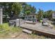 Backyard with a deck, hot tub and lush trees at 910 E North Bay St, Tampa, FL 33603