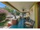 Relaxing front porch view featuring a blue floor, comfortable seating, and views of the neighborhood at 910 E North Bay St, Tampa, FL 33603